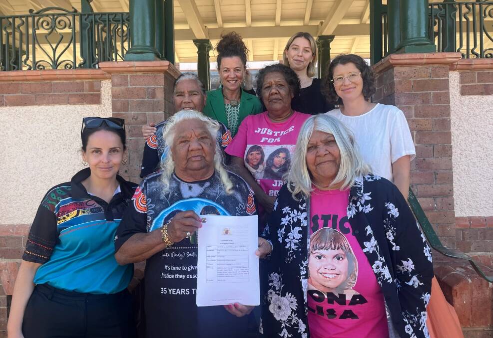 The mothers of Mona Lisa Smith and Jacinta Rose Smith with supporters as the inquest findings were handed down. Picture supplied