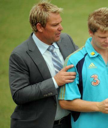 A word from the wise: Shane Warne gets in Steve Smith's ear before play on the second day of the Boxing Day Test against Pakistan in 2009. Photo: Vince Caligiuri
