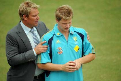 A word from the wise: Shane Warne gets in Steve Smith's ear before play on the second day of the Boxing Day Test against Pakistan in 2009. Photo: Vince Caligiuri