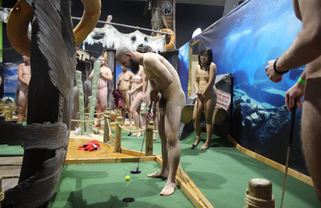 The nude mini-golf event organised by the Young Nudists of Australia. A green wristband means the person has consented to photographs. Photo has been digitally censored.Source: SMH. 