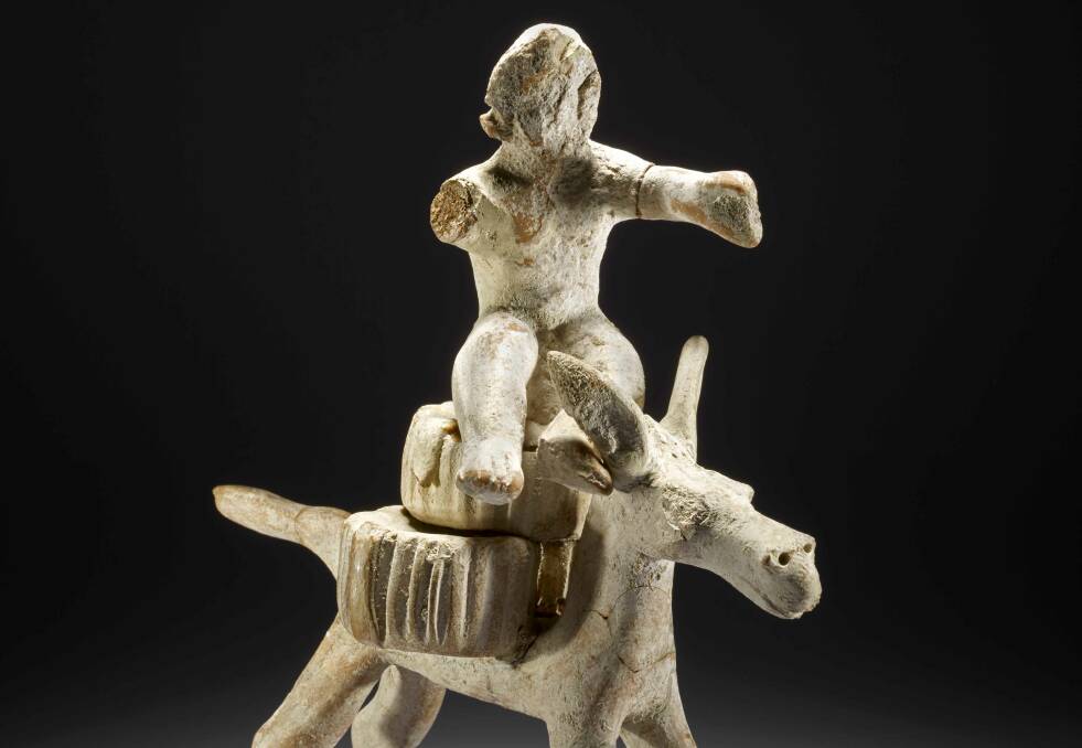 Terracotta figure of a cheese seller, circa 390-370 BCE.