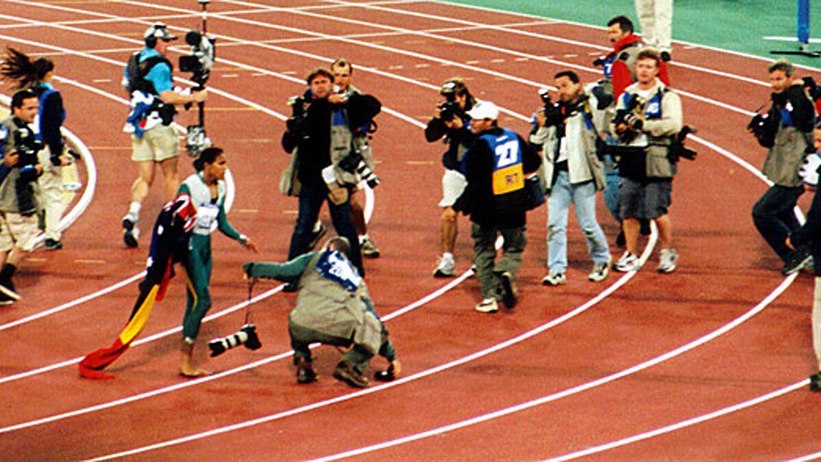 Cathy Freeman at the Sydney Olympics. Photo: Ian @ ThePaperboy.com, via Wikimedia Commons