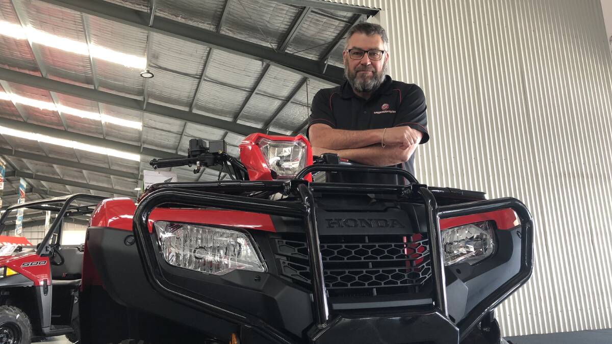 Wagga Motorcycles sales manager Andrew Stemp with a Honda quad bike that's still in stock. Picture: Jody Lindbeck