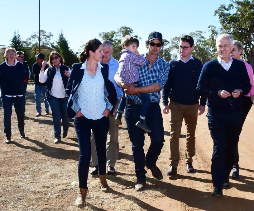 ON THE GROUND: Prime Minister Malcolm Turnbull (far right) and Agriculture Minister David Littleproud (second from right) with Ashlea and Phil Miles of Strathmore, Trangie. Photo: BELINDA SOOLE