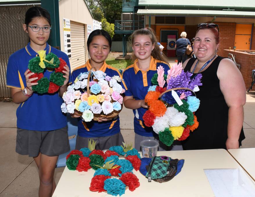 Drought fair: Dubbo South Public students Giang Hoang, Jia-Rong Tan and Miliana Tierney with Sally Constable. Photo: Belinda Soole. 