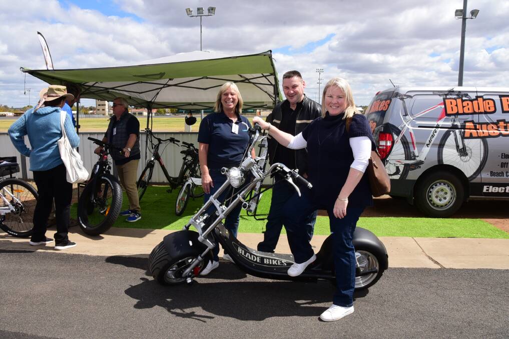 Latest gear: Sandra Sullivan, from Blade Bikes Australia, Melbourne, with Paul and Natalie Cole from Brocklehurst at the 2017 show. For more visit www.ruralscene.com.au. Photo: Belinda Soole. 