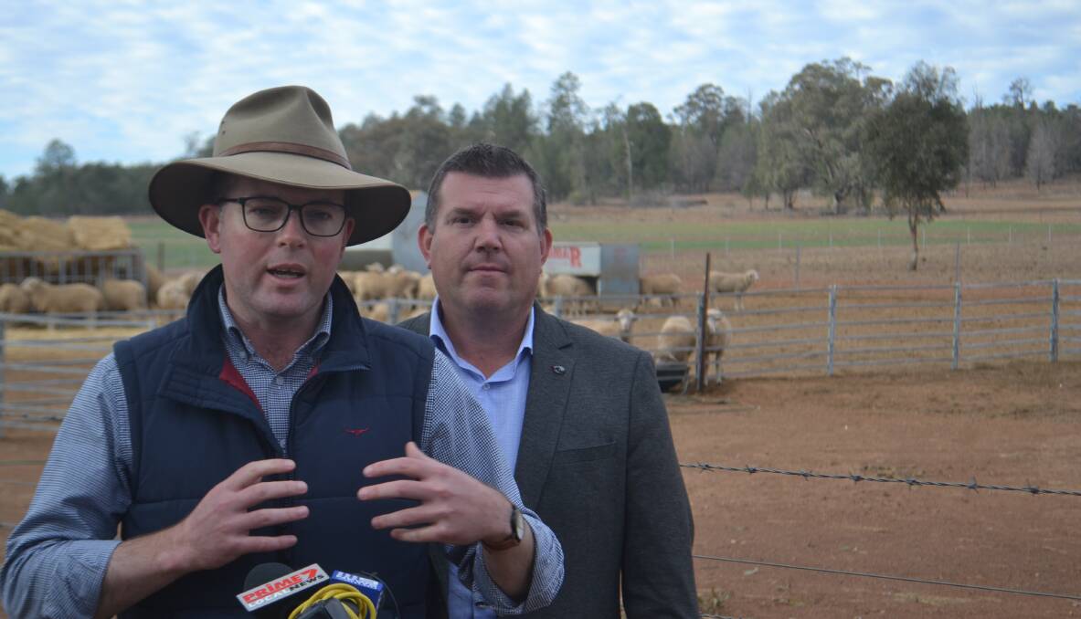 Minister for Agriculture Adam Marshall with Dubbo MP Dugald Saunders during a drought tour of the central west in 2019. Photo: Ryan Young. 