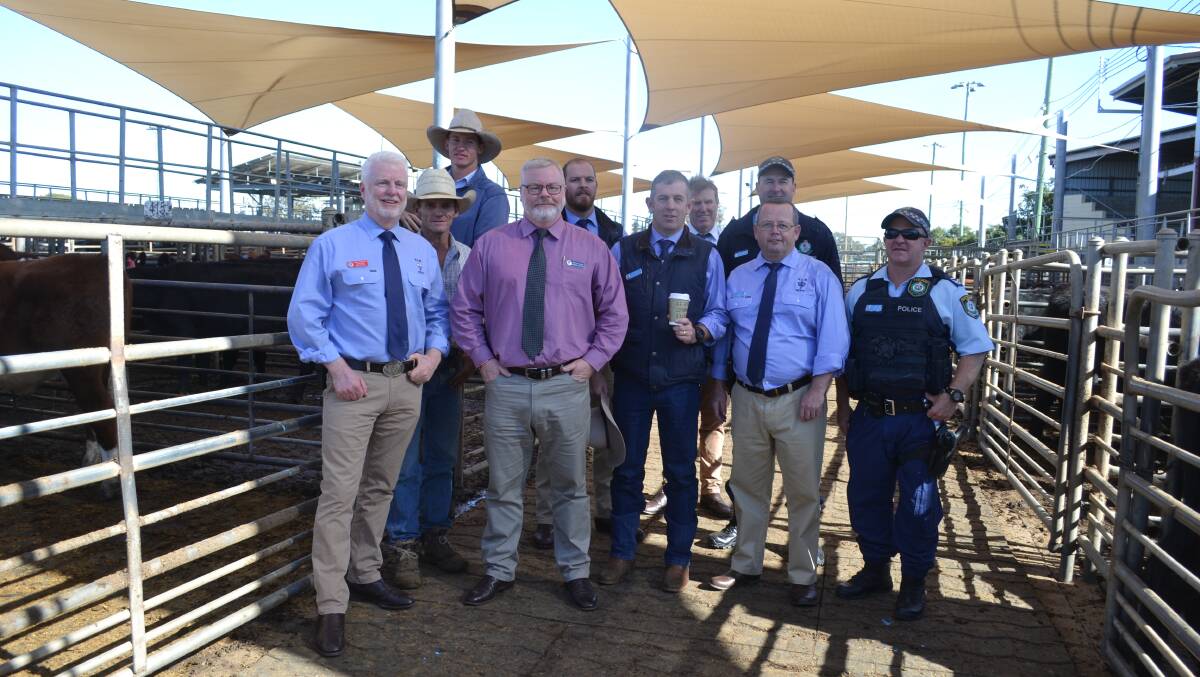 Bonding over coffee: NSW Police and Rural Crime Investigators, with local agents during the Coffee with a Cop event at the Dubbo Saleyards. Photo: Taylor Jurd.