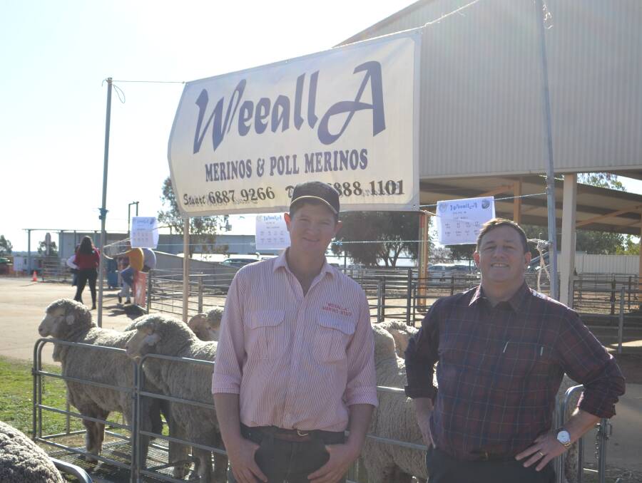 Field Day success: Event organiser Stuart McBurnie, Weealla Merino stud, Gilgandra and Andrew Dennis, wool consultant. Photo: Taylor Jurd. 