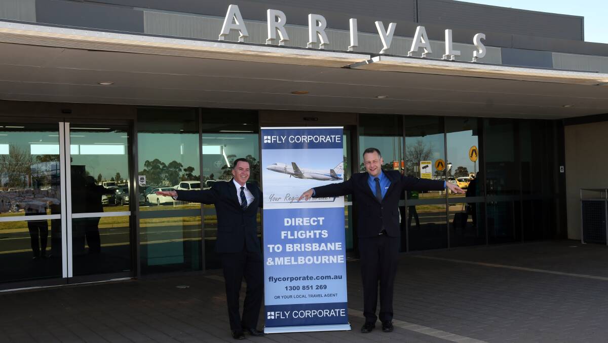 DIRECT FLIGHTS: Dubbo Regional Council mayor Ben Shields and Fly Corporate sales manager Geoff Woodham promote its new services at Dubbo City Regional Airport on Tuesday. Photo: BELINDA SOOLE  