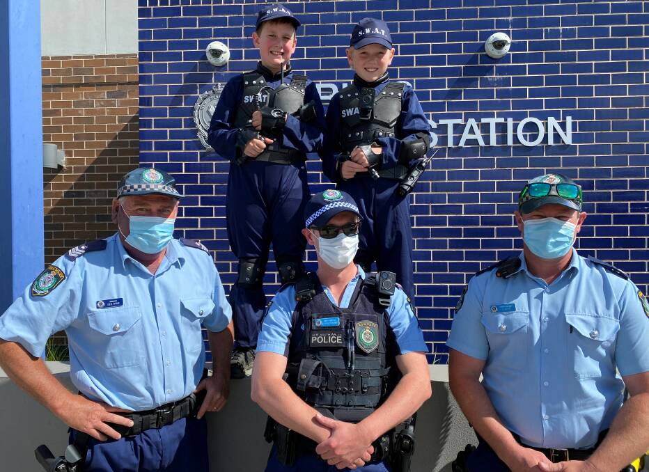 Swat Police from East Parkes Primary School Ned Jones (left) and Charlie Rix (right) with Parkes Police Sergeant Ged Ryan (Left) Senior Constable Woolstencroft (Middle) and Senior Constable Dane Budd (Right).