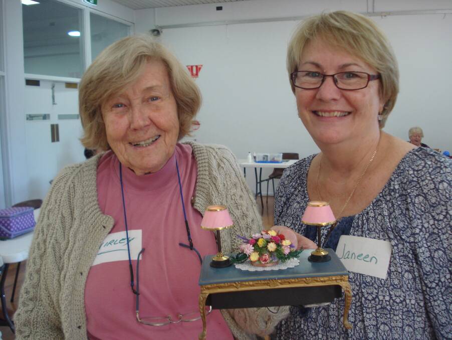 IT'S THE LITTLE THINGS: Shirley Putnin (left) with her miniature lamps and Western Australian Miniaturists Association secretary Janeen Foster.