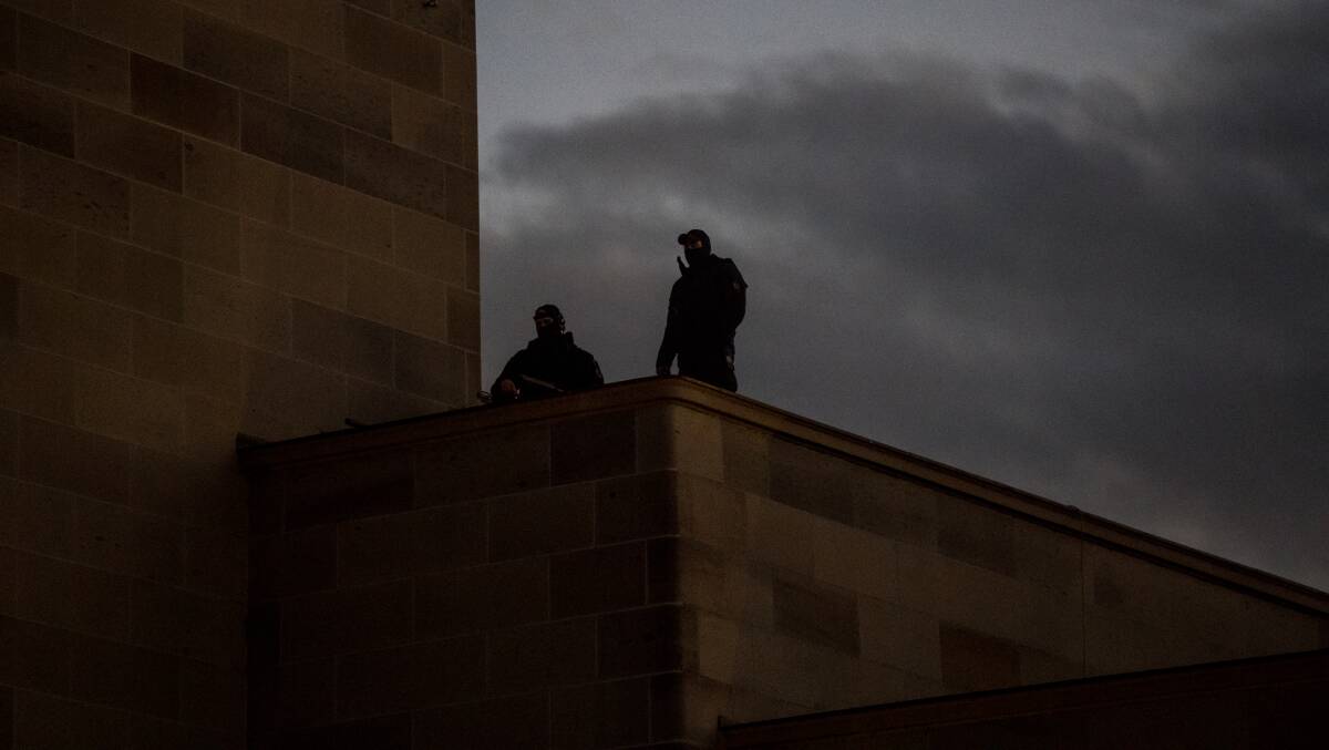 Snipers were seen on the roof of the war memorial during the dawn service. Photo: Karleen Minney