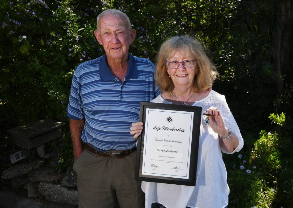Family ties: Sue Lockwood with father Ken, whom she joined as a life member of the Tamworth Netball Association. Her mother Dot was also previously awarded life membership. Photo: Gareth Gardner 2711202GGB03
