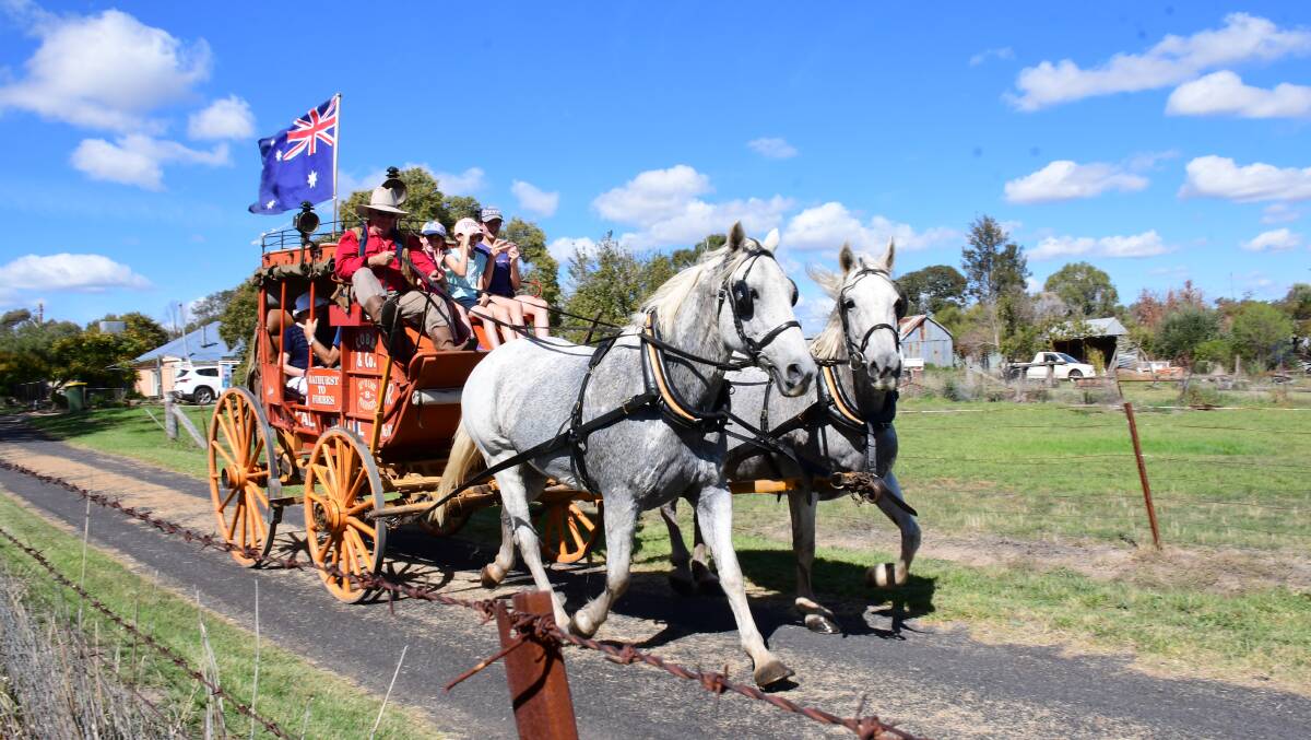 Historical: The Cobb and Co. stagecoach heads into town carrying groups of passengers. Photo: Amy McIntyre. 