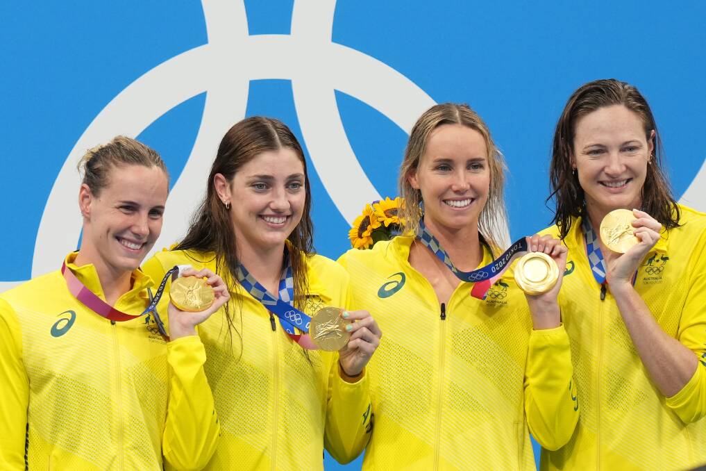 Australias 4x100m Womens freestyle relay team (from left) Bronte Campbell, Meg Harris, Emma McKeon and Cate Campbell hold their Gold Medals after winning the final with a world record time at the Tokyo Aquatic Centre on Sunday. Picture: AAP/Joe Giddens