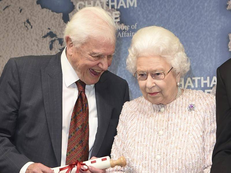 The Queen has presented David Attenborough with an award for his Blue Planet series.
