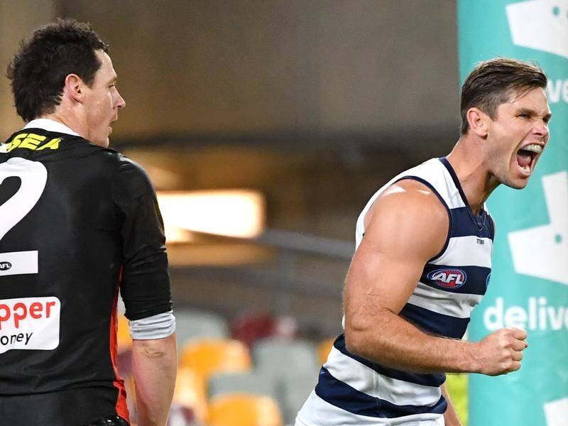 Tom Hawkins (right) booted five goals for Geelong as the Cats made easy work of St Kilda in the AFL.