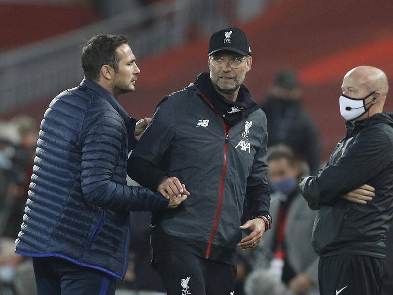 Jurgen Klopp (centre) feels the sacking of Chelsea rival Frank Lampard (left) was "really harsh".