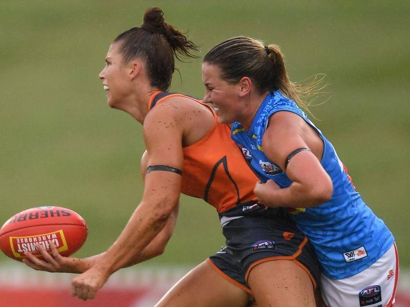 Taylah Davies (l) kicked a goal for the Giants as they beat the Gold Coast by 10 points in the AFLW.