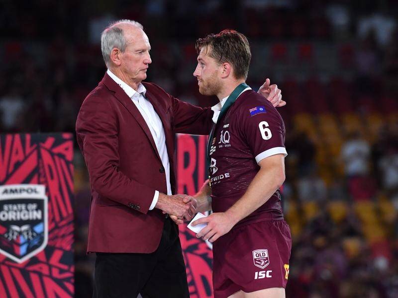 Cameron Munster was presented with the Wally Lewis Medal by Maroons' coach Wayne Bennett.