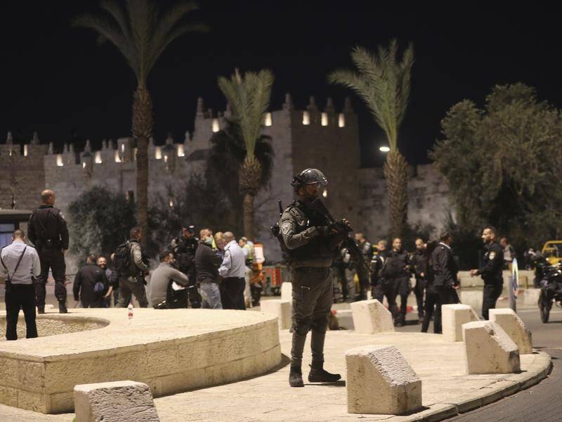 Israeli police shot dead a Palestinian after he stabbed an ultra-Orthodox Jew in Jerusalem.