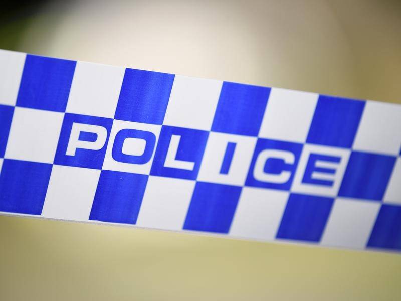 A woman has died in the collision of a bus and a car on Queensland's Warrego Highway east of Roma.