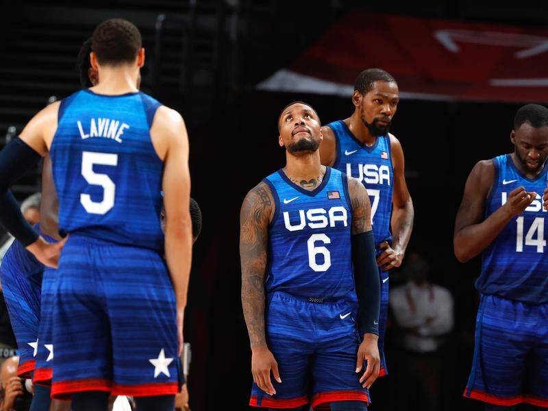 Damian Lillard (No.6) looks to the heavens after the USA's shock basketball loss at the Olympics.
