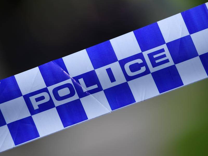 Police are hunting for an armed man who allegedly threatened staff in a NSW bank and post office.