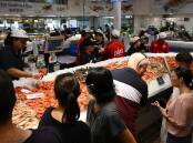 Crowds have flocked to the Sydney Fish Market for the traditional Good Friday buy-up. (Dean Lewins/AAP PHOTOS)