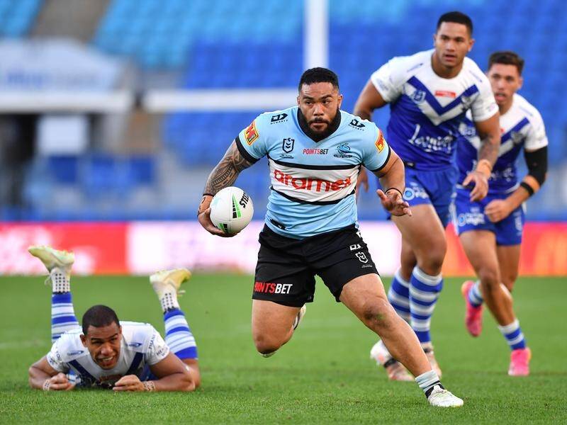Siosifa Talakai beats the Canterbury defence to score a try in the Sharks' NRL win.