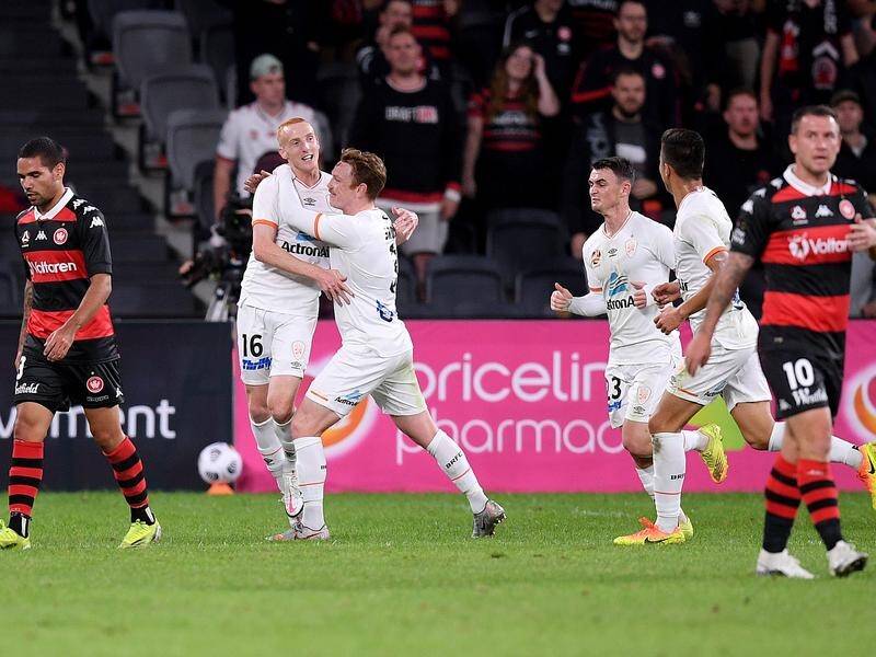Joshua Brindell-South (2L) celebrates his goal in the Roar's 2-1 win over Western Sydney.