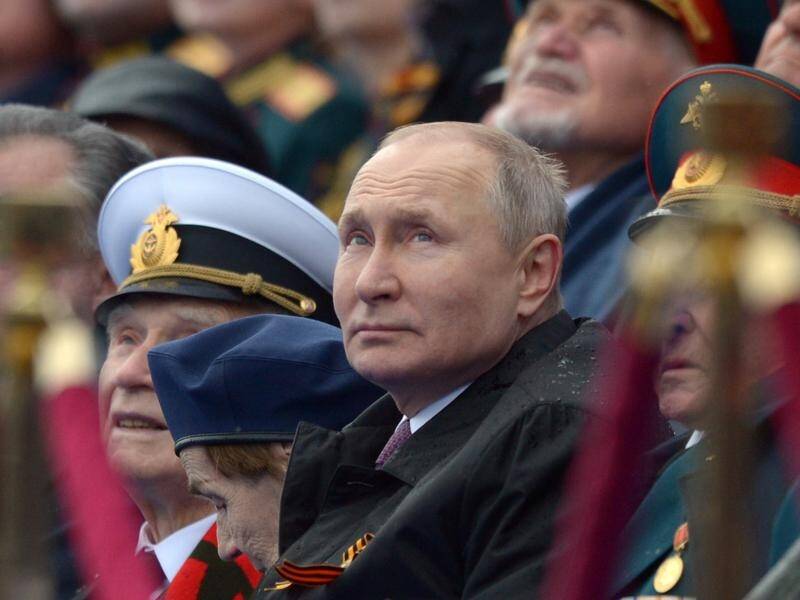 Russian President Vladimir Putin watches the Victory Day military parade in Moscow.