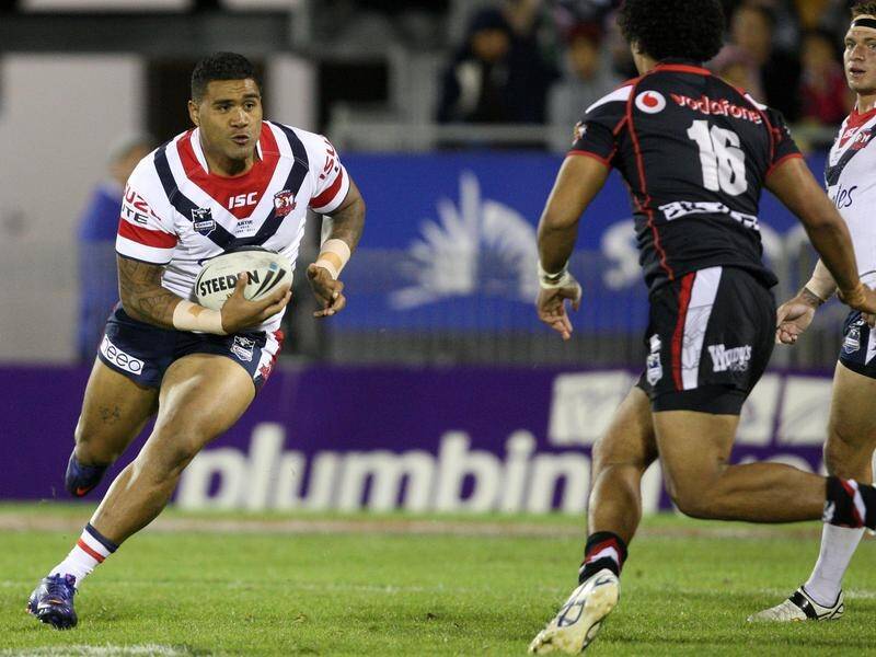 Mose Masoe (l), seen during his playing days with the Roosters, has suffered a spinal injury.