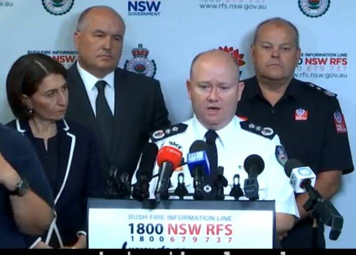 STAY SAFE: NSW RFS Commissioner Shane Fitzsimmons and other emergency services during the safety briefing on Tuesday morning.